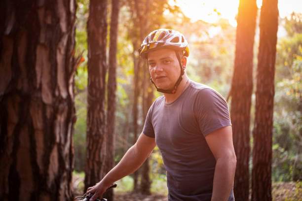 istock Bike rider at a pine trees forest. 1278459983