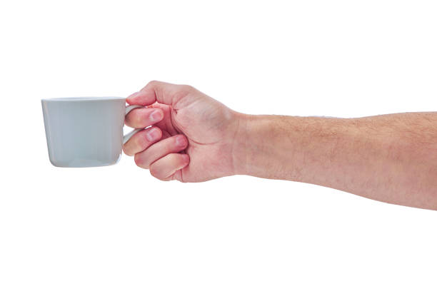 istock Man holding a cup of coffee, isolated on white 1278460041
