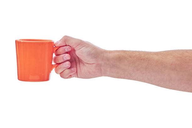 istock Man holding a cup of coffee, isolated on white 1278460199