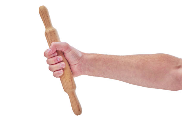 istock hand with wooden rolling pin isolated on white background 1278460222