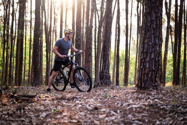 Portrait of a happy and beautiful man on a bicycle
