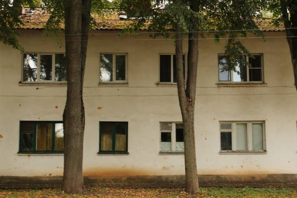 istock Two trees in front of the house 1278461331