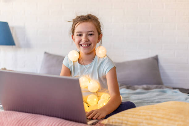 istock Young girl in bed with laptop 1278463208