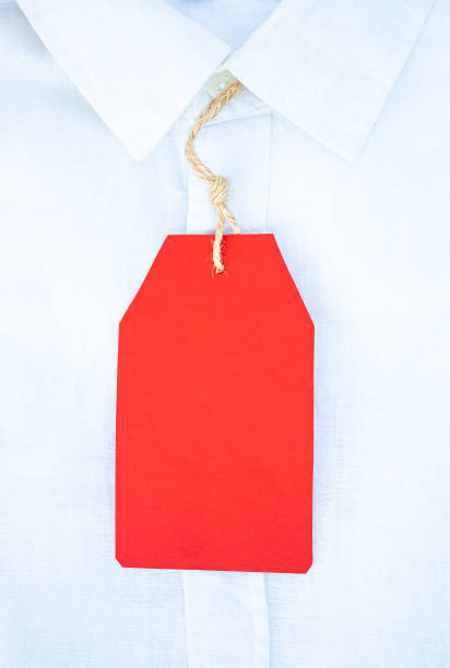 istock red paper tag on white shirt 1278463507