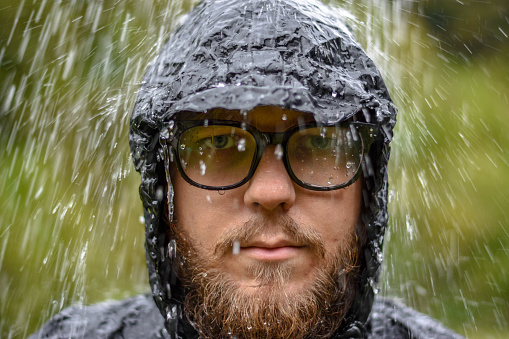 While photographing, it started to rain with the model - dressed in a waterproof suit