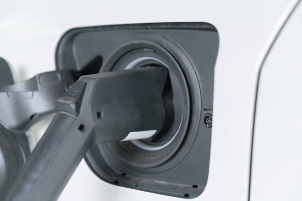 istock Electric Car charger plug into the socket charging 1278465003