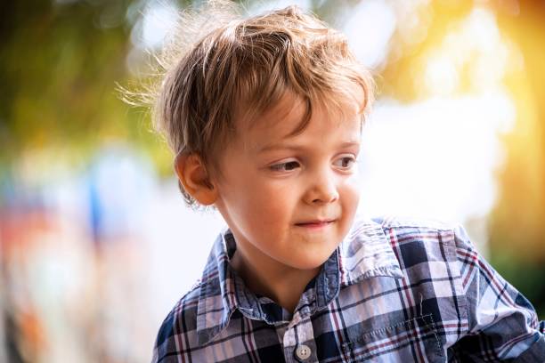 istock Smiling little boy looking away 1278465908