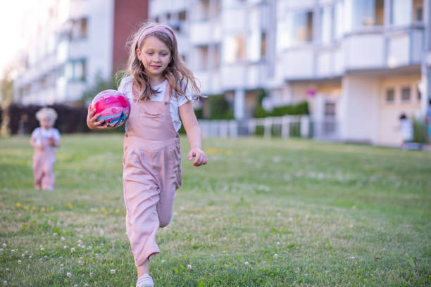 Little girl playing in public park.