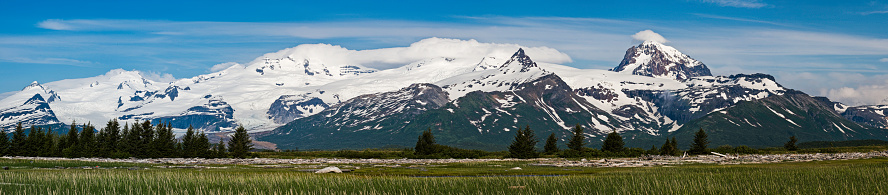 Hallo Bay, Katmai National Park, Alaska. Panorama of the Hallo Bay area showing the beach, fields and the mountains with glaciers and snow.  Aleutian Range