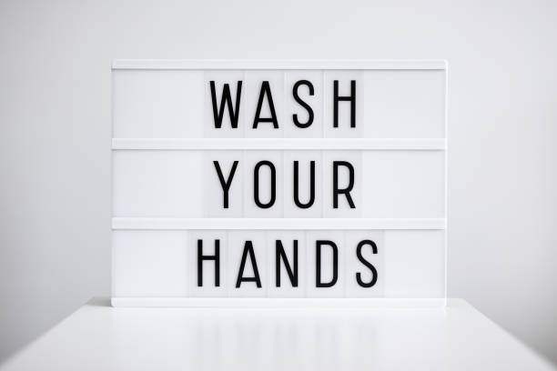 istock coronavirus pandemic and hand hygiene concept - light box with wash your hands message 1278469530