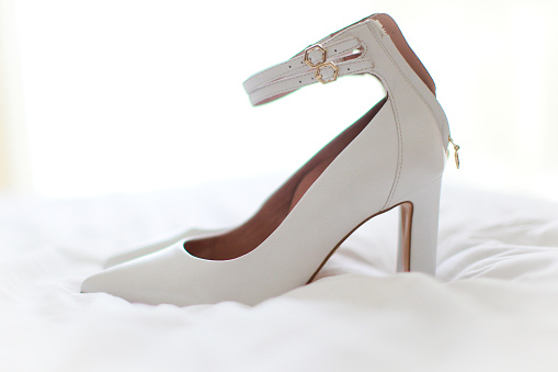 Big on a pair of black and white bridal shoes