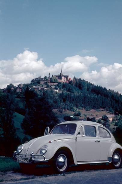 Germany (exact location unfortunately not known), 1975. Driving break in front of a rural castle backdrop.