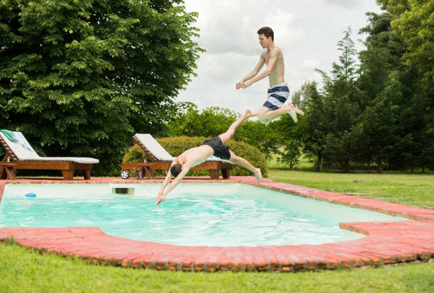 istock Diving into the swimming pool 1278471141