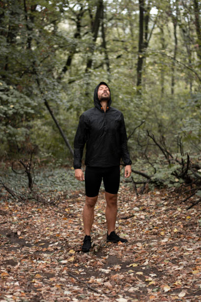 istock A man standing in the forest with his eyes closed. 1278473230