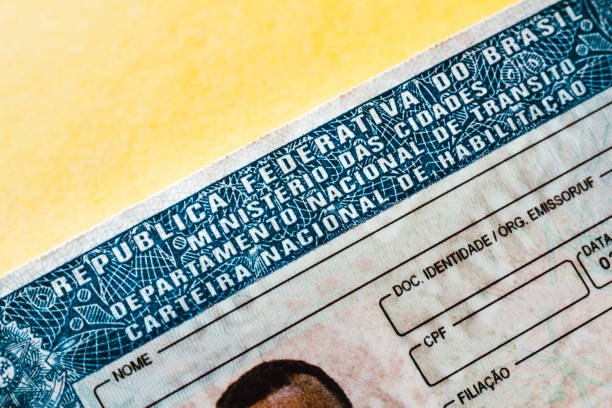 In this photo illustration the close-up detail of the Carteira Nacional de Habilitação of Brazil (CNH) In this photo illustration the close-up detail of the Carteira Nacional de Habilitação of Brazil (CNH) driver's license stock pictures, royalty-free photos & images