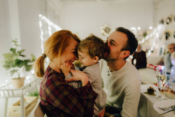 istock Family celebrating Christmas at home 1278480085