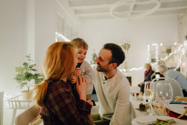 istock Family celebrating Christmas at home 1278480211