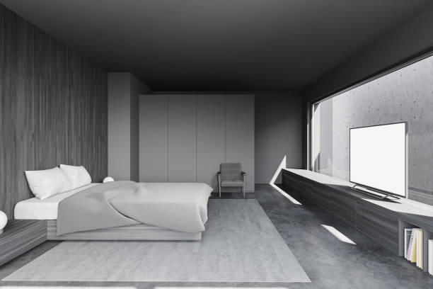 istock Grey and wooden bedroom with TV 1278481216