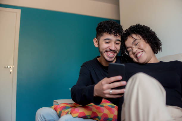 istock Couple at home on cellphone 1278482037