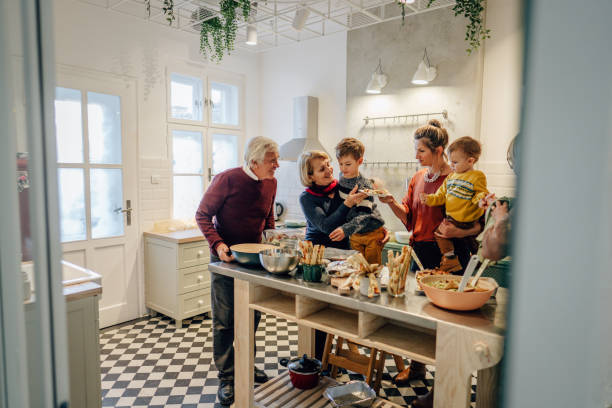 istock Family preparing Thanksgiving dinner in the kitchen 1278483433