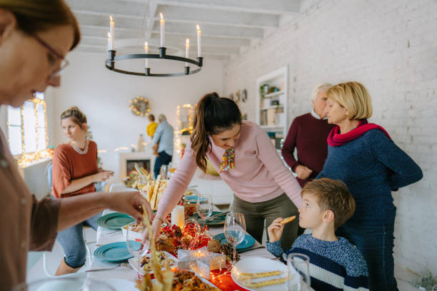 istock Family setting up the table for Christmas dinner 1278484749