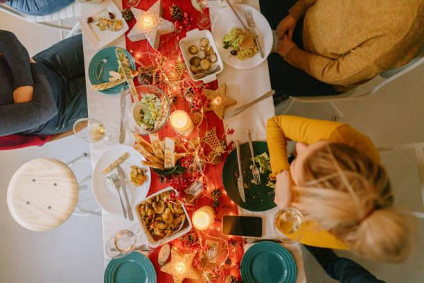 istock Family celebrating December Holidays over dinner 1278484825