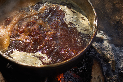 close up of molasses boiling