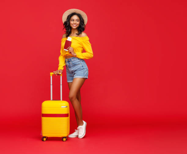 istock Stylish ethnic traveler with suitcase 1278488025