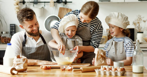 istock Positive family preparing pastry together 1278488078