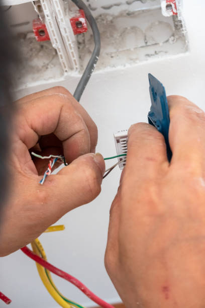 istock electrician install the internet outlet panel on the wall 1278491135