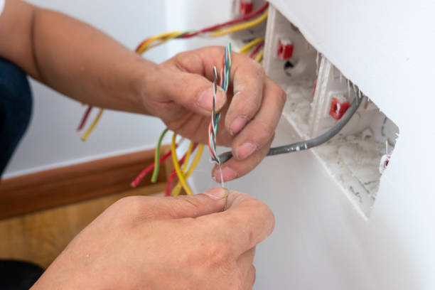 istock electrician install the internet outlet panel on the wall 1278491144