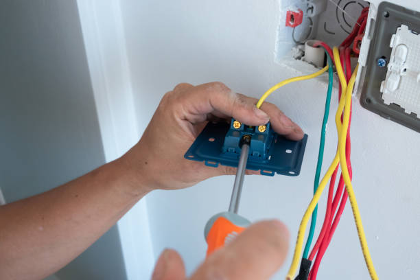 istock electrician install the outlet panel on the wall 1278491184