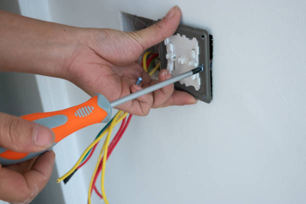 istock electrician install the outlet panel on the wall 1278491192