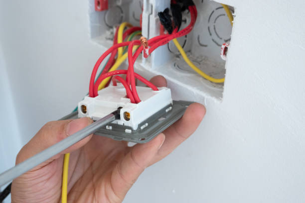 istock electrician install the outlet panel on the wall 1278491199