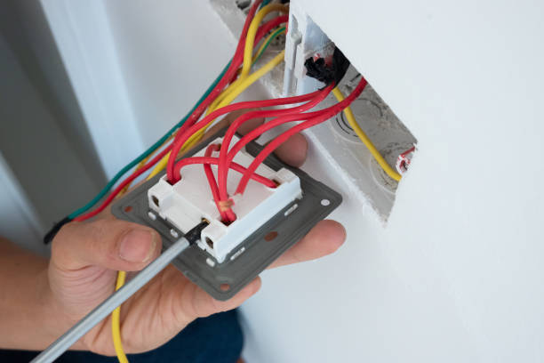 istock electrician install the outlet panel on the wall 1278491205