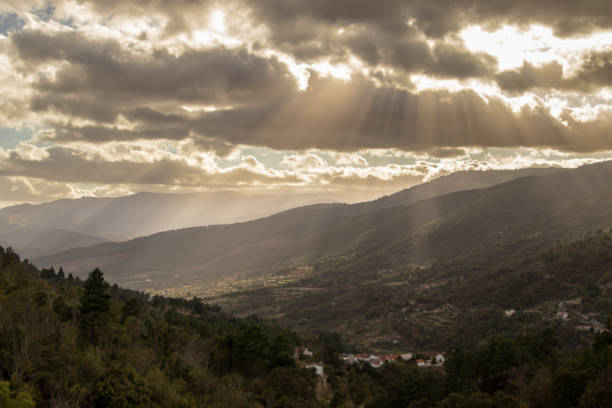 istock fantastic mountain landscape, with the sun's rays radiating through the cloudy sky, creating a fantastic scenery 1278491220
