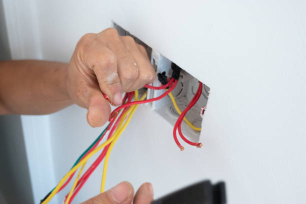 istock electrician install the outlet panel on the wall 1278491244