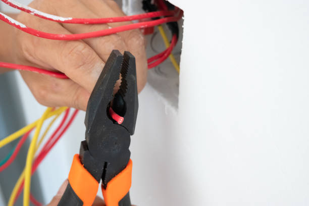 istock electrician install the outlet panel on the wall 1278491253