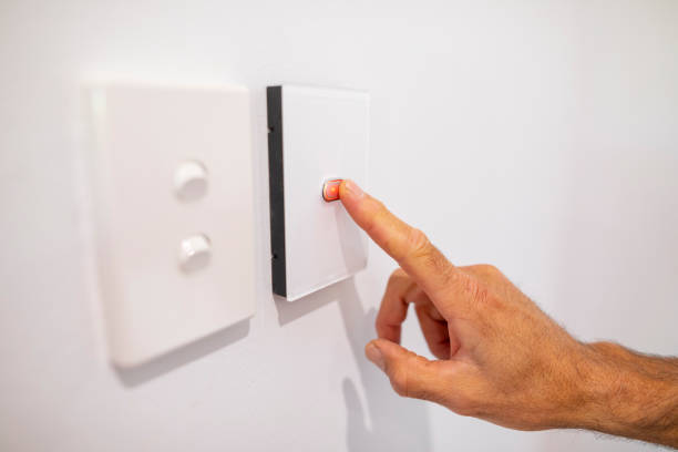 istock Middle Aged Man Using an Air Conditioner Thermostat 1278492064