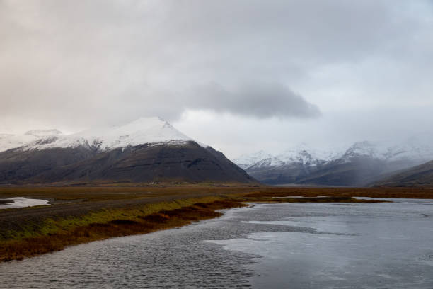 istock clouds over the snowy mountains in iceland 1278492917