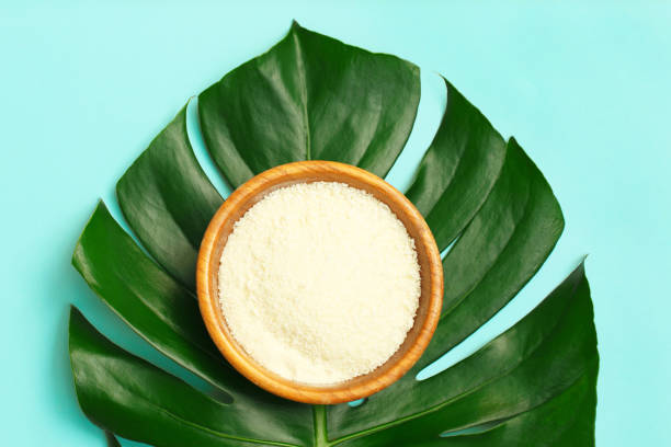 istock Collagen powder in bowl on palm leaf background. 1278494701