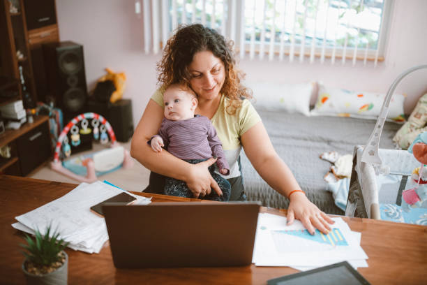 istock Mother Is Working From Home While She Is Taking Care For Her Child 1278494832