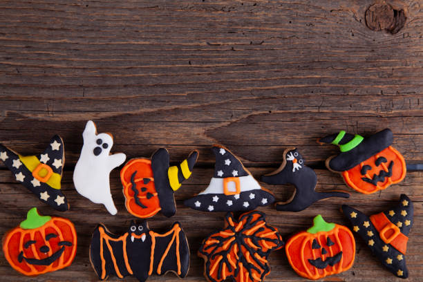 istock Halloween gingerbread cookies on wooden rustic background. 1278497410