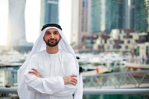 Sheikh standing on the city of Dubai Marina
