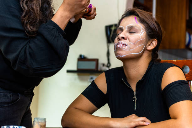 istock woman putting makeup on another woman 1278499678