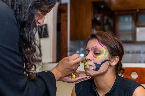 istock woman putting makeup on another woman 1278499679