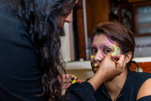 istock woman putting makeup on another woman 1278499727