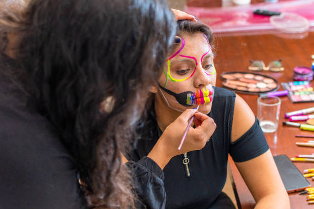 istock woman putting makeup on another woman 1278500407