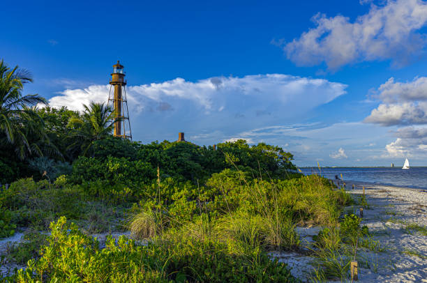 Sanibel Island Lighthouse and Beach with Blue Sky and Clouds