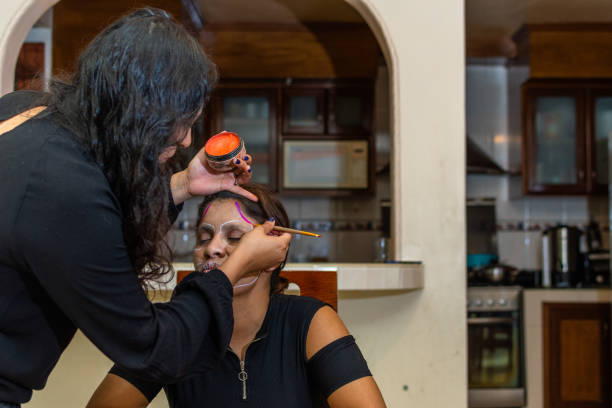 istock woman putting makeup on another woman 1278500518
